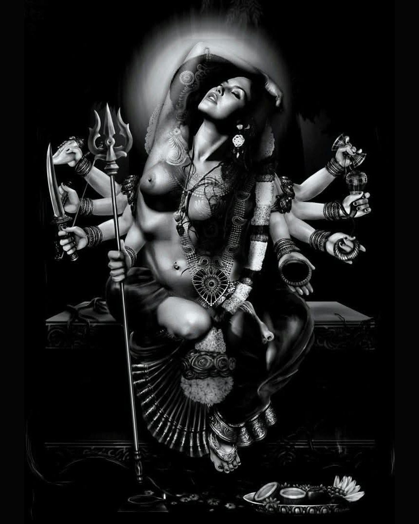 A many-armed goddess in black and white, dancing with a trident and a blade